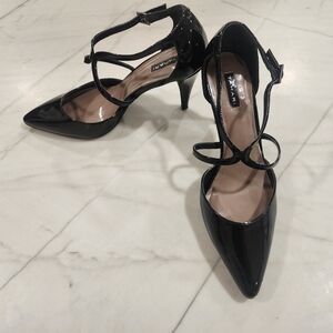 Tahari black patent leather high heels.